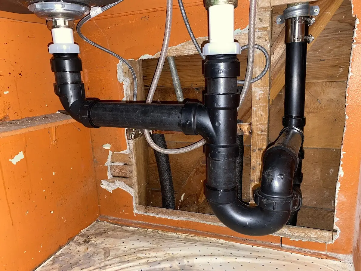 Professional Garbage Disposal Repair equipment and tools on the job in Midlothian
